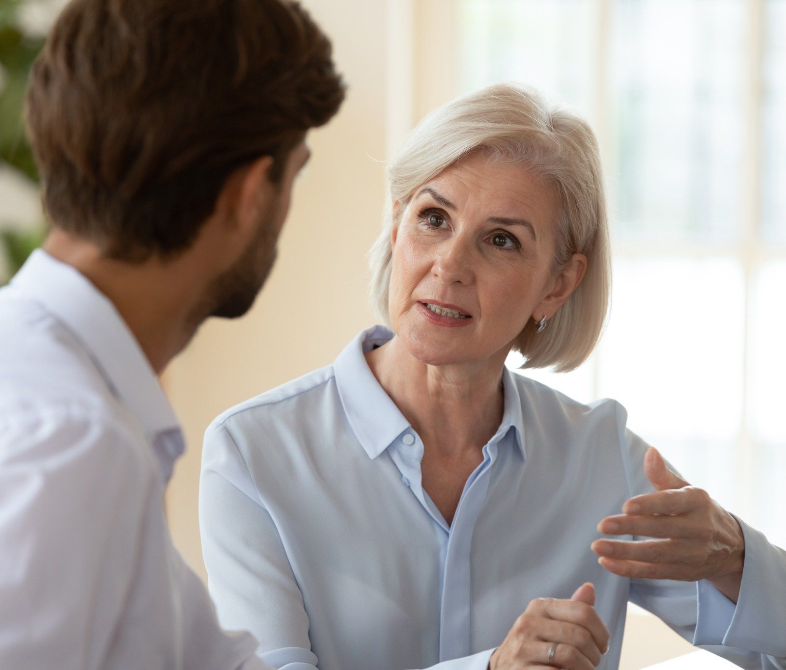 woman explaining APR and interest rates to man