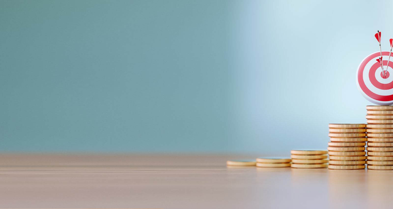 Several stacks of coins with a target and arrows on top of the tallest one