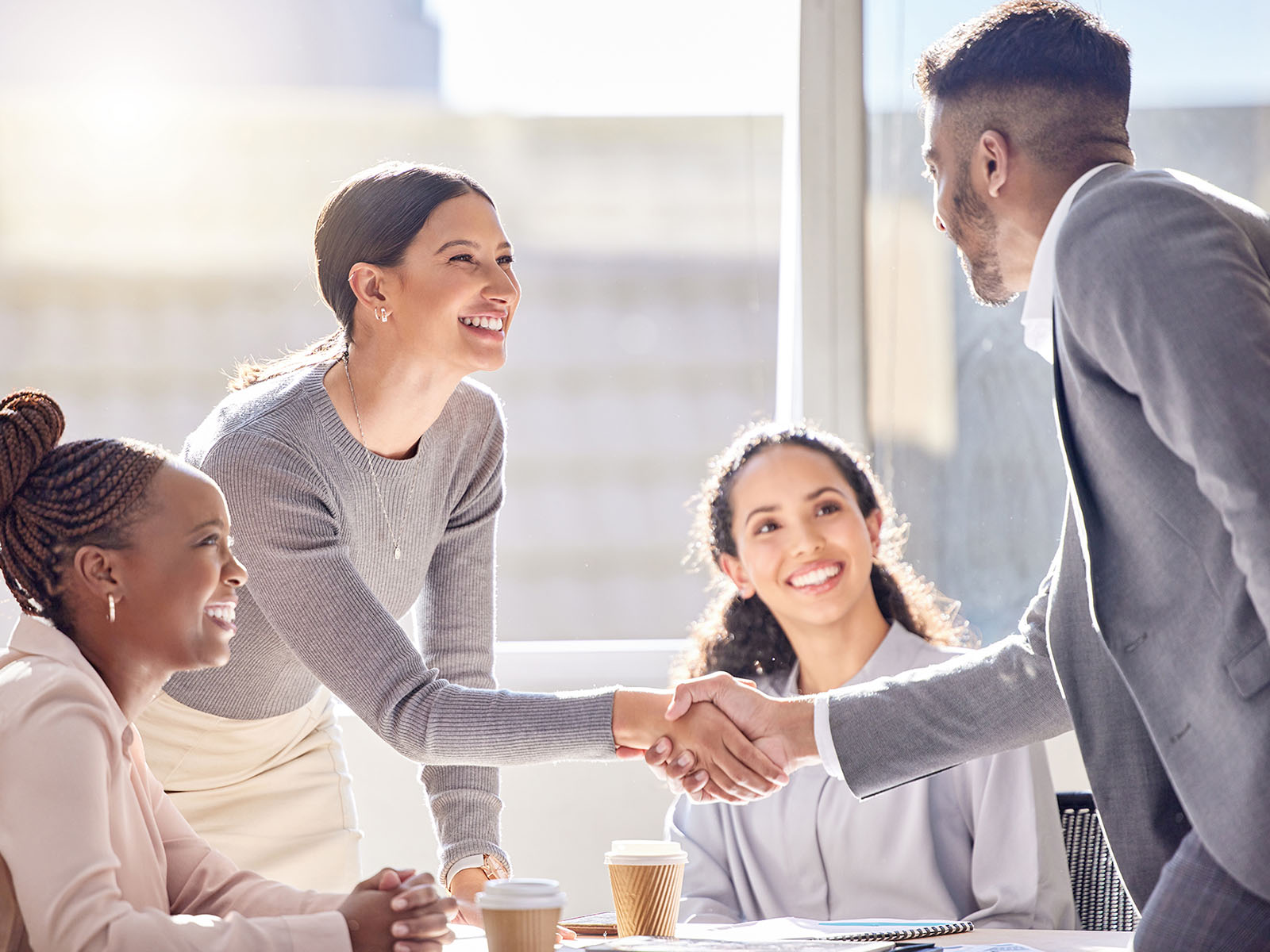 Group of business people shaking hands